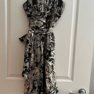 Beautiful classy silk dress. Has a sash that ties at the waist perfect condition